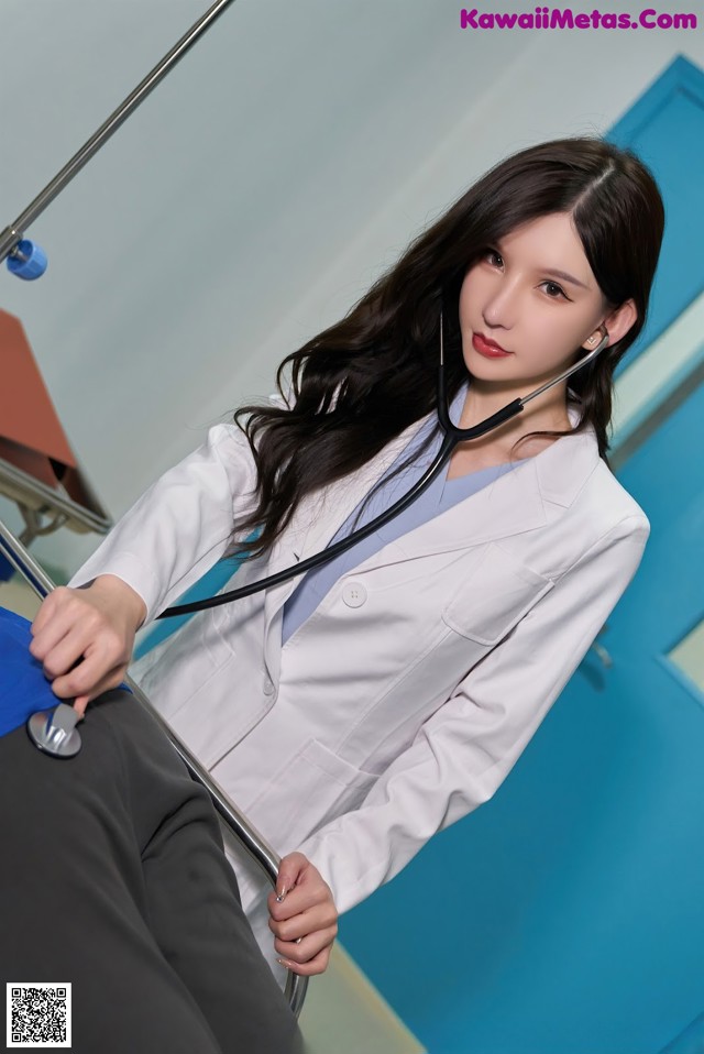 A woman in a white lab coat with a stethoscope.