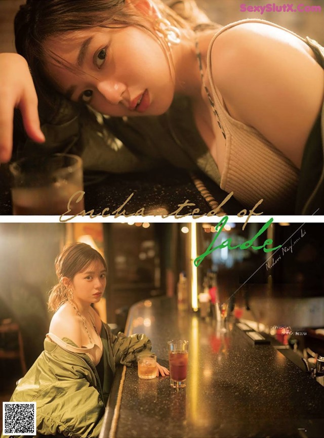 A woman sitting at a bar with a glass of beer.