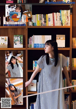 A woman sitting on a balcony holding a book.