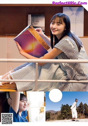 A woman sitting on the floor holding a book.