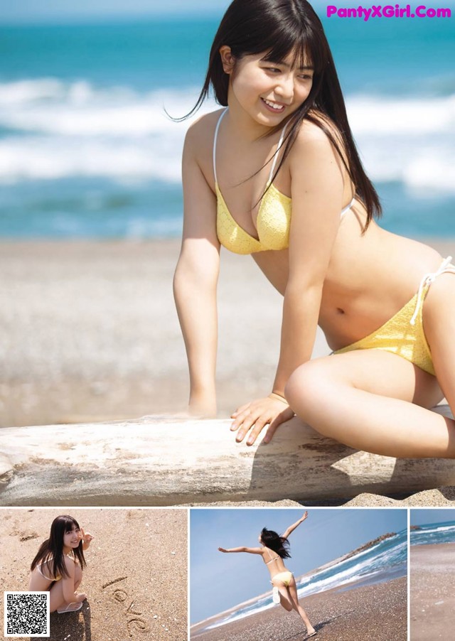 A woman in a yellow bikini sitting on a rock on the beach.